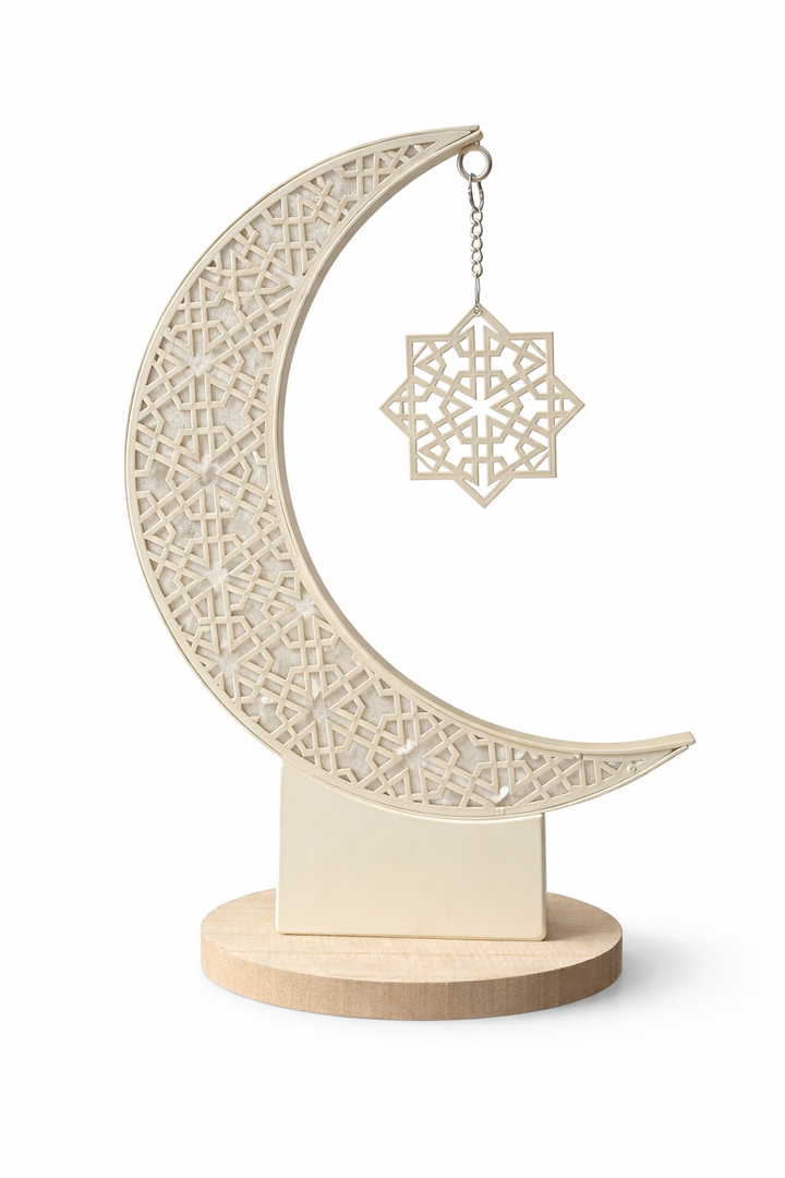 Decorative moon-shaped lantern with intricate patterns on a white background