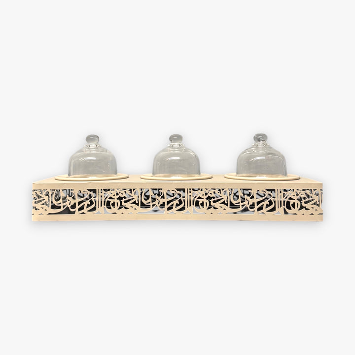 Decorative shelf with three glass jars on a white background