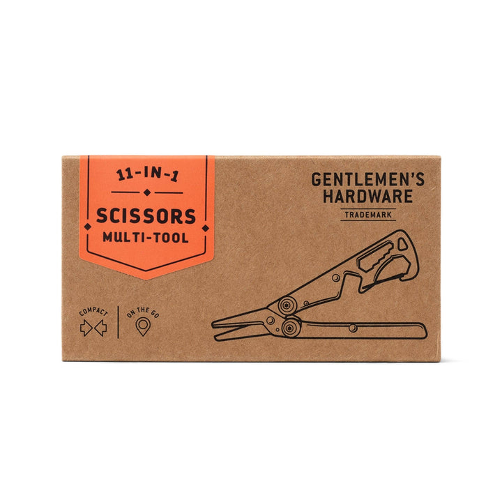 A brown kraft paper box for a 11-in-1 scissors multi-tool by Gentlemen's Hardware, featuring an orange label and a line drawing of the tool on a white background.