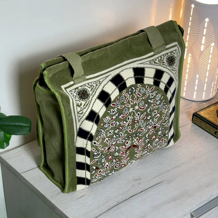 Green bag with intricate patterns on a wooden surface