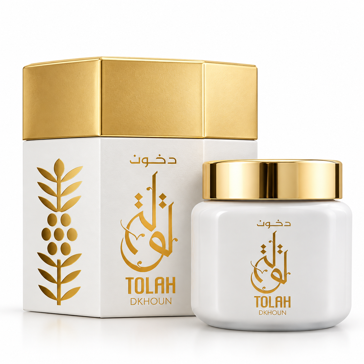 A white cosmetic jar with a shiny gold lid stands in front of its matching white and gold box. The packaging features gold Arabic calligraphy and the brand name 'TOLAH' with 'DGHOUN' underneath.