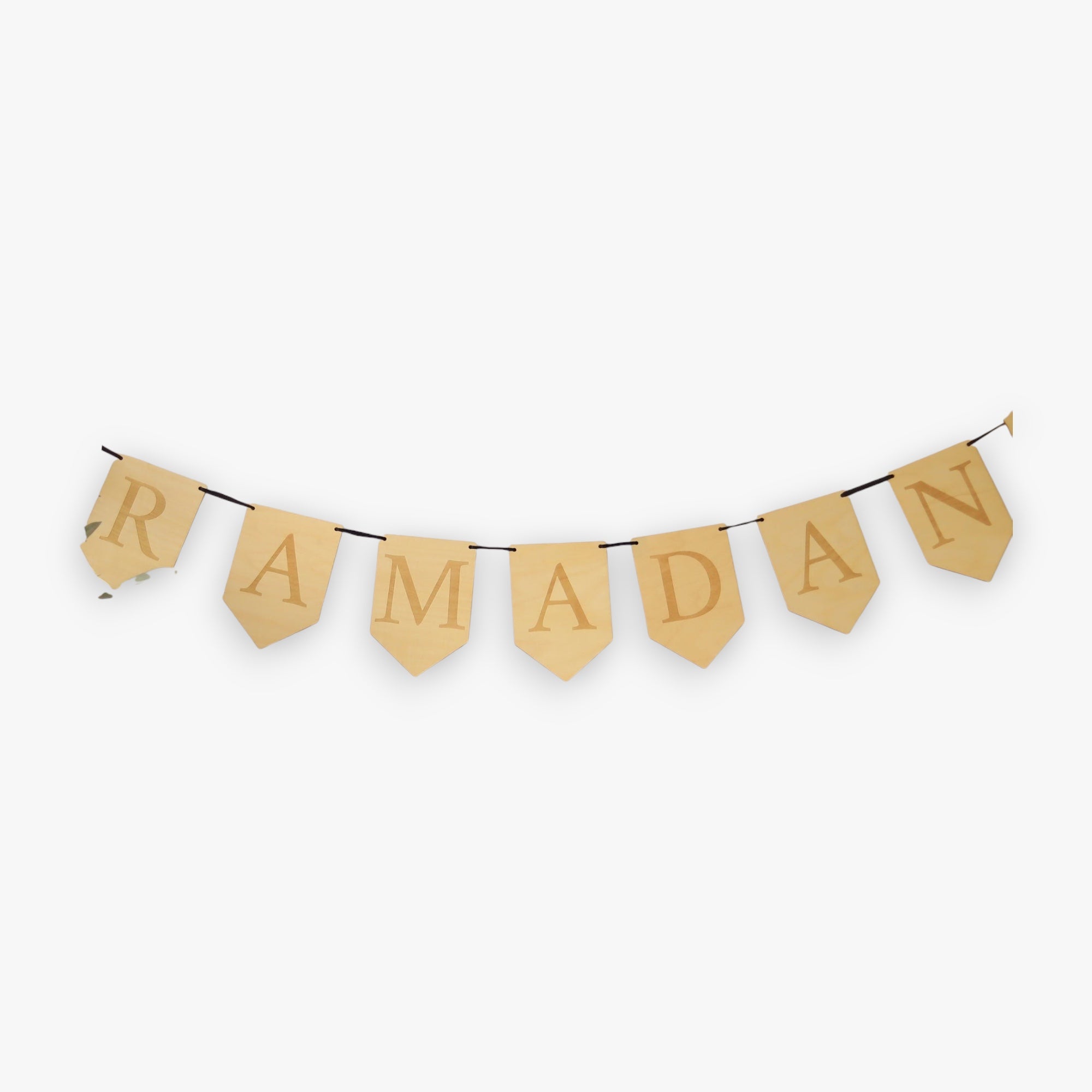Wooden 'RAMADAN' banner on a white background